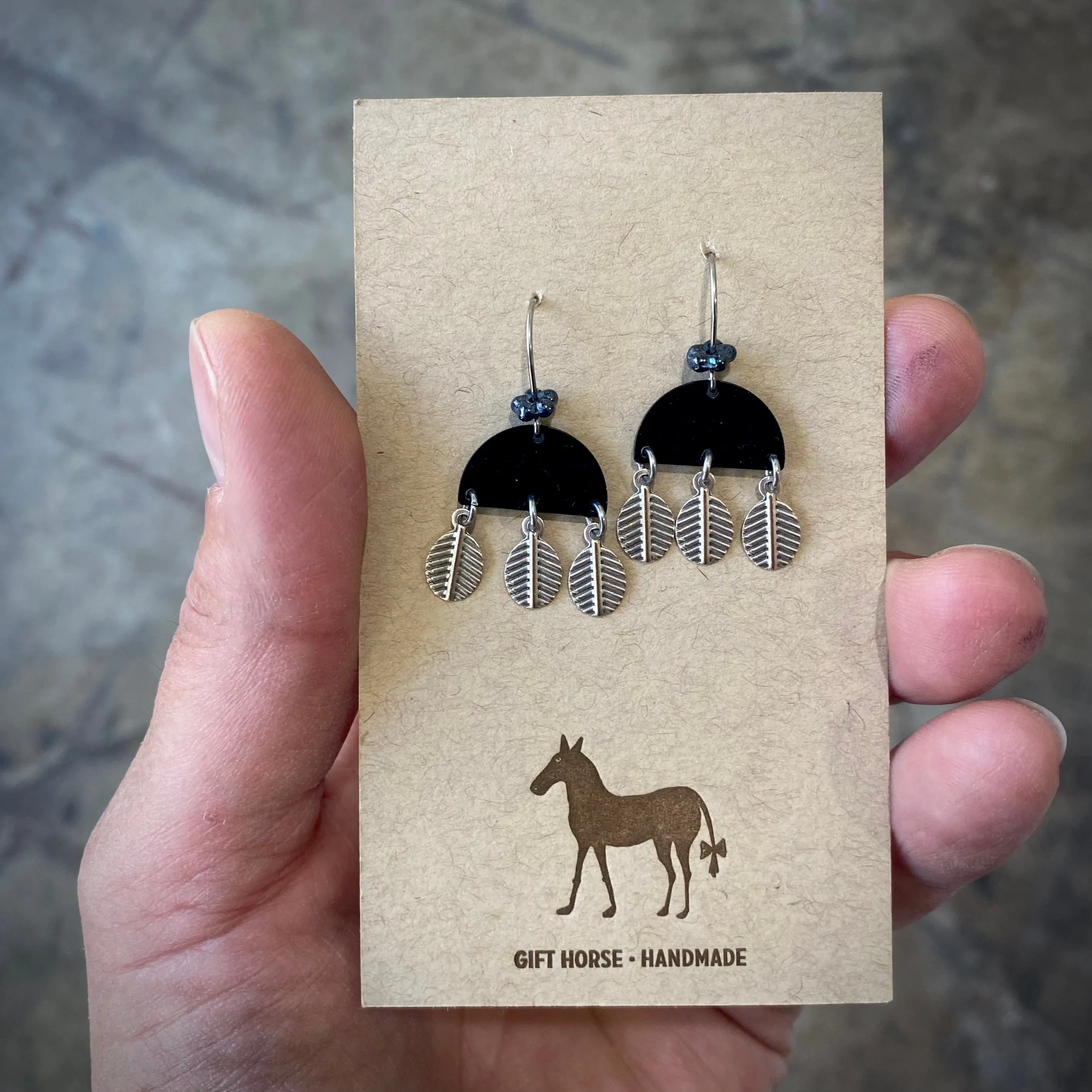 Black bell with dangly silver leaves earring